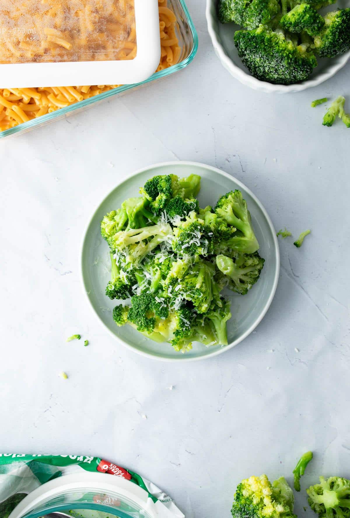 plate of broccoli with parmesan cheese on top