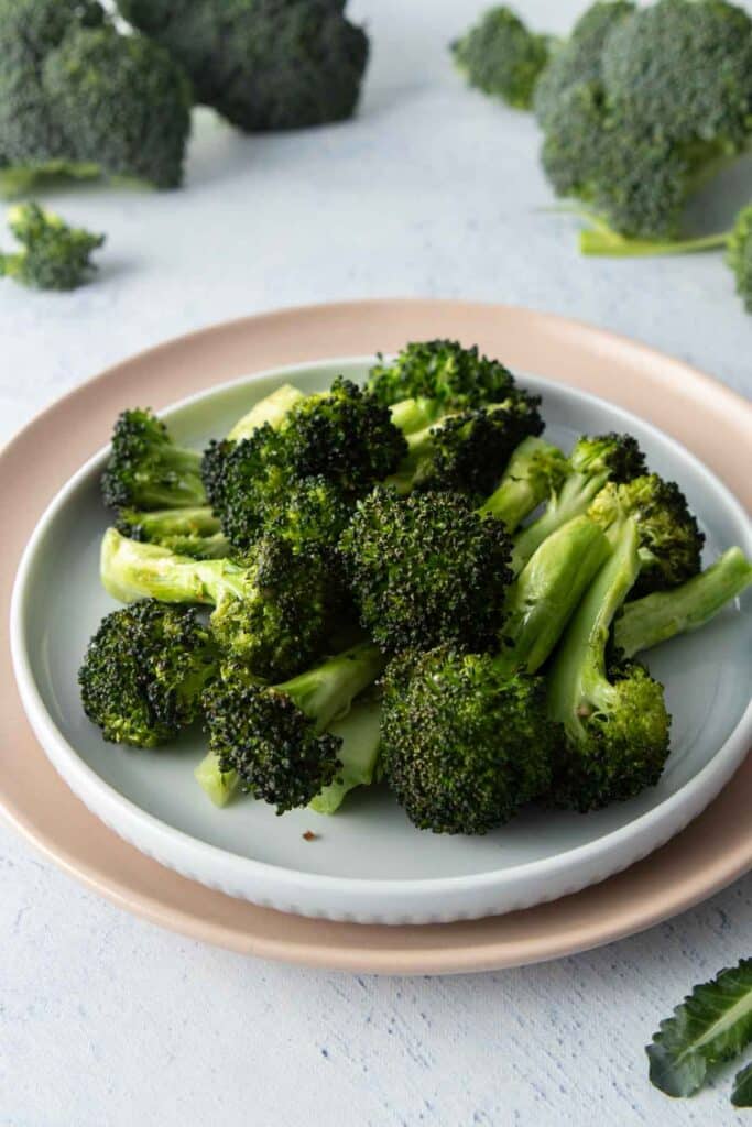 sheet pan broccoli on pink plate