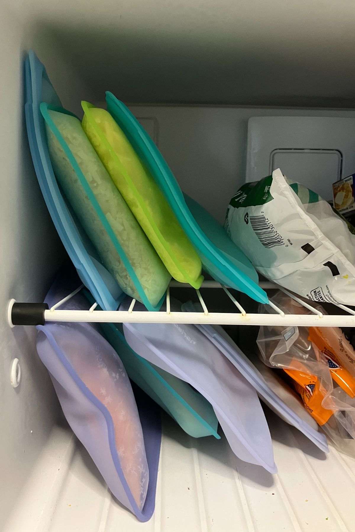 colorful bags of food in freezer