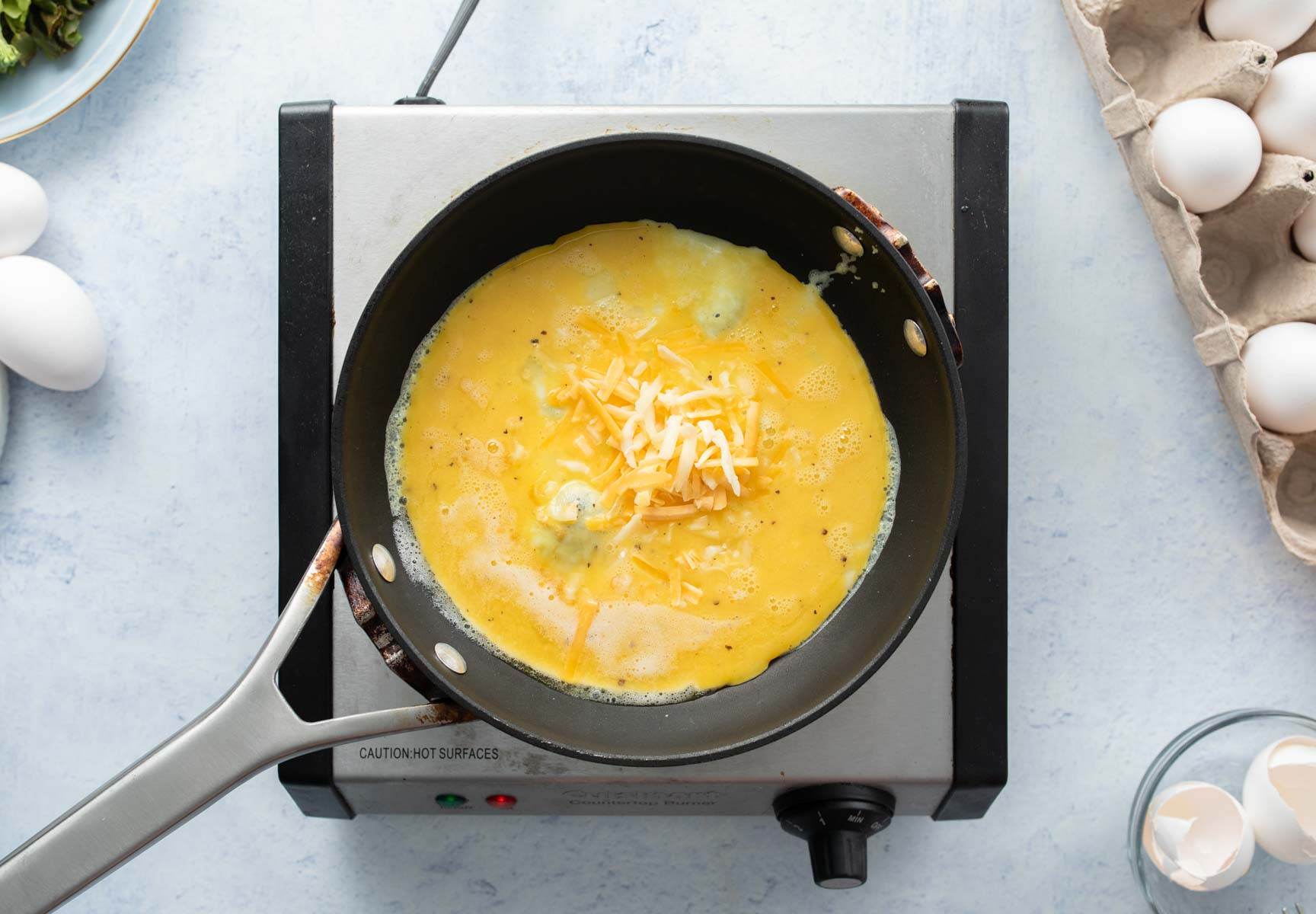 eggs with cheese in pan