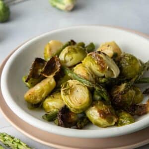 bowl of browned brussels sprouts and asparagus
