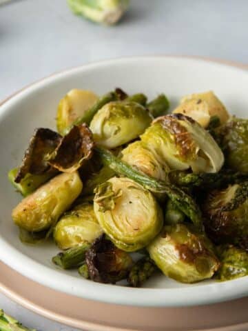 bowl of browned brussels sprouts and asparagus