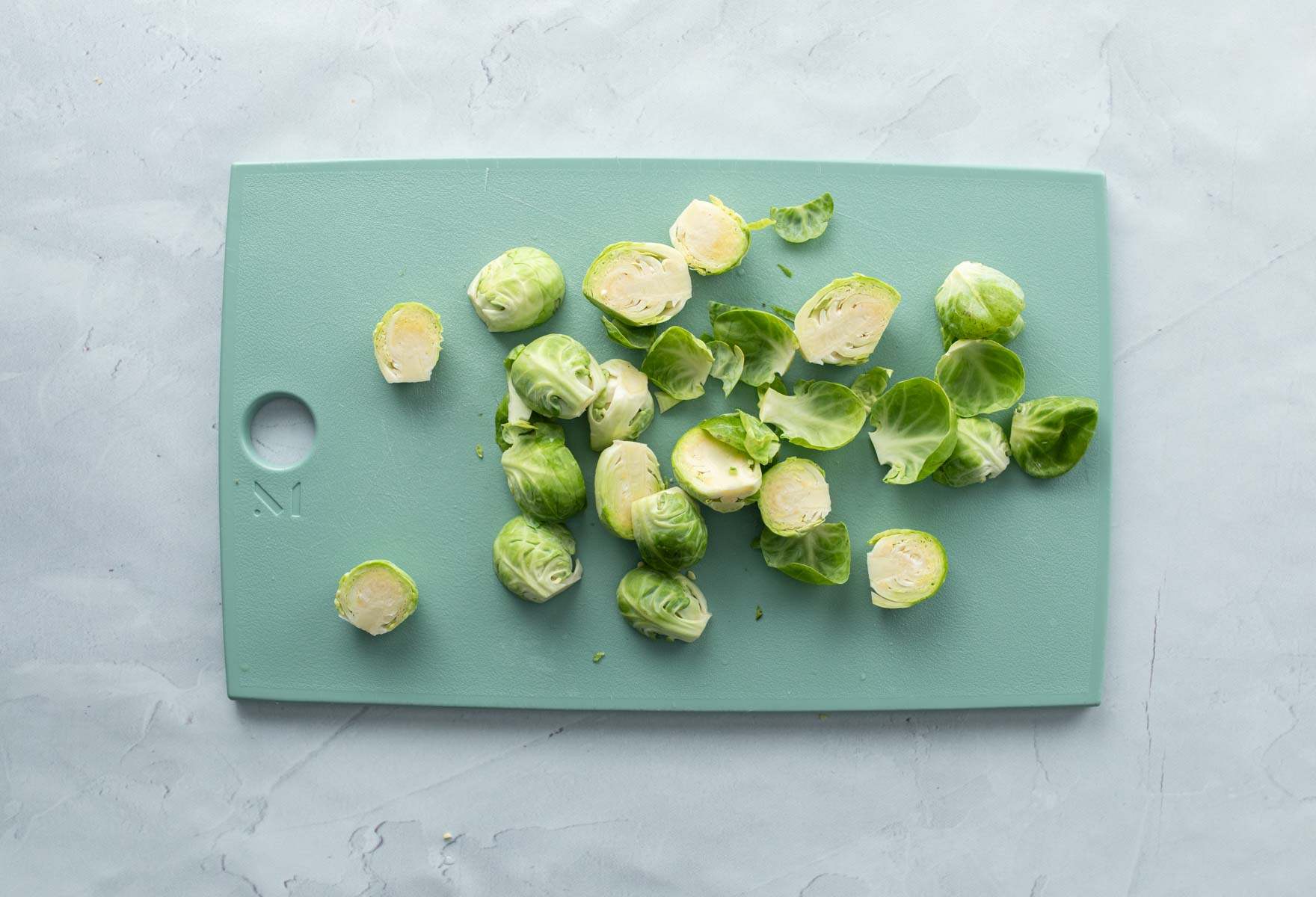 halved brussels sprouts on cutting board
