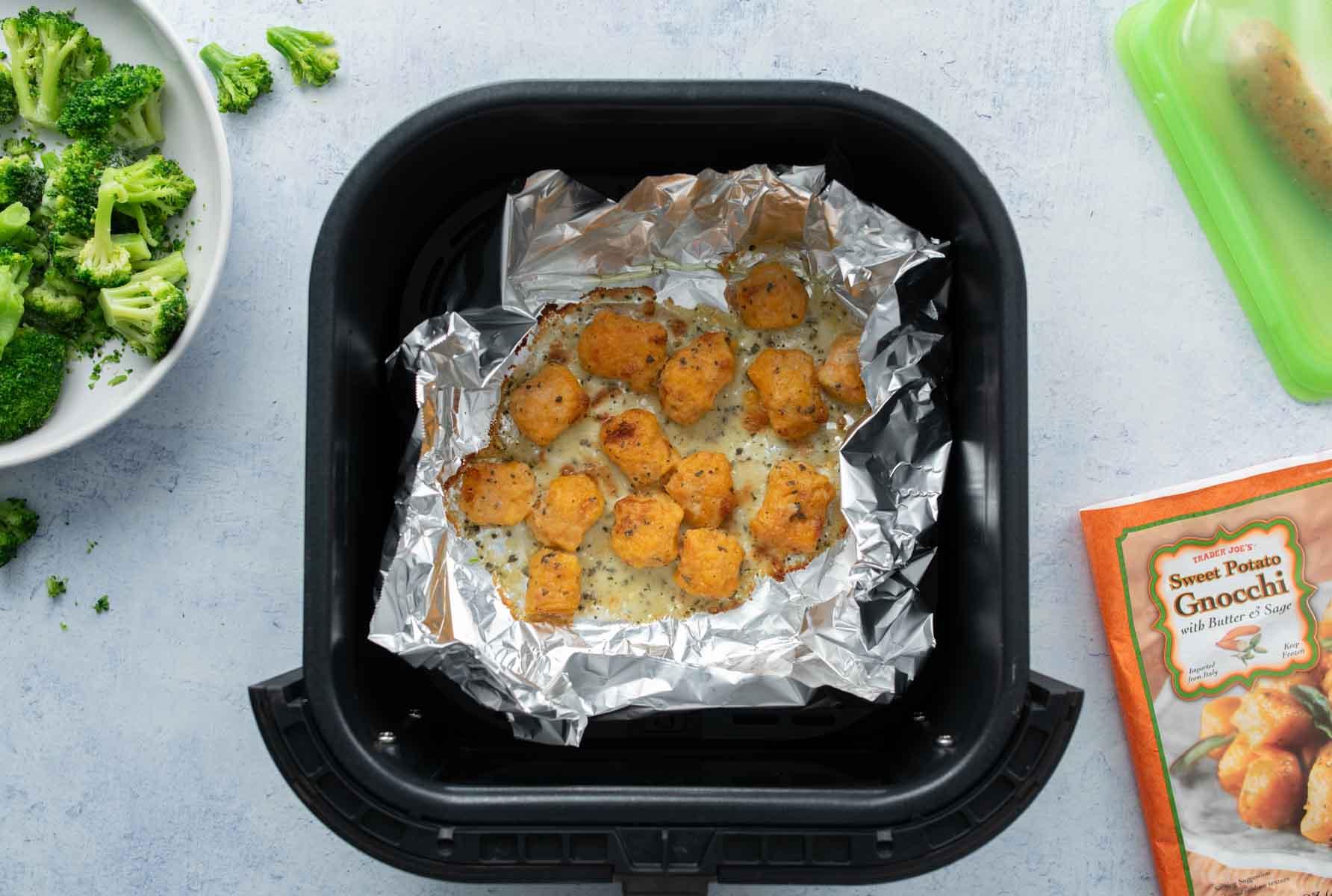 sweet potato gnocchi in foil in air fryer basket