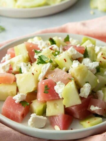 chopped beets and cucumber, parsley on plate