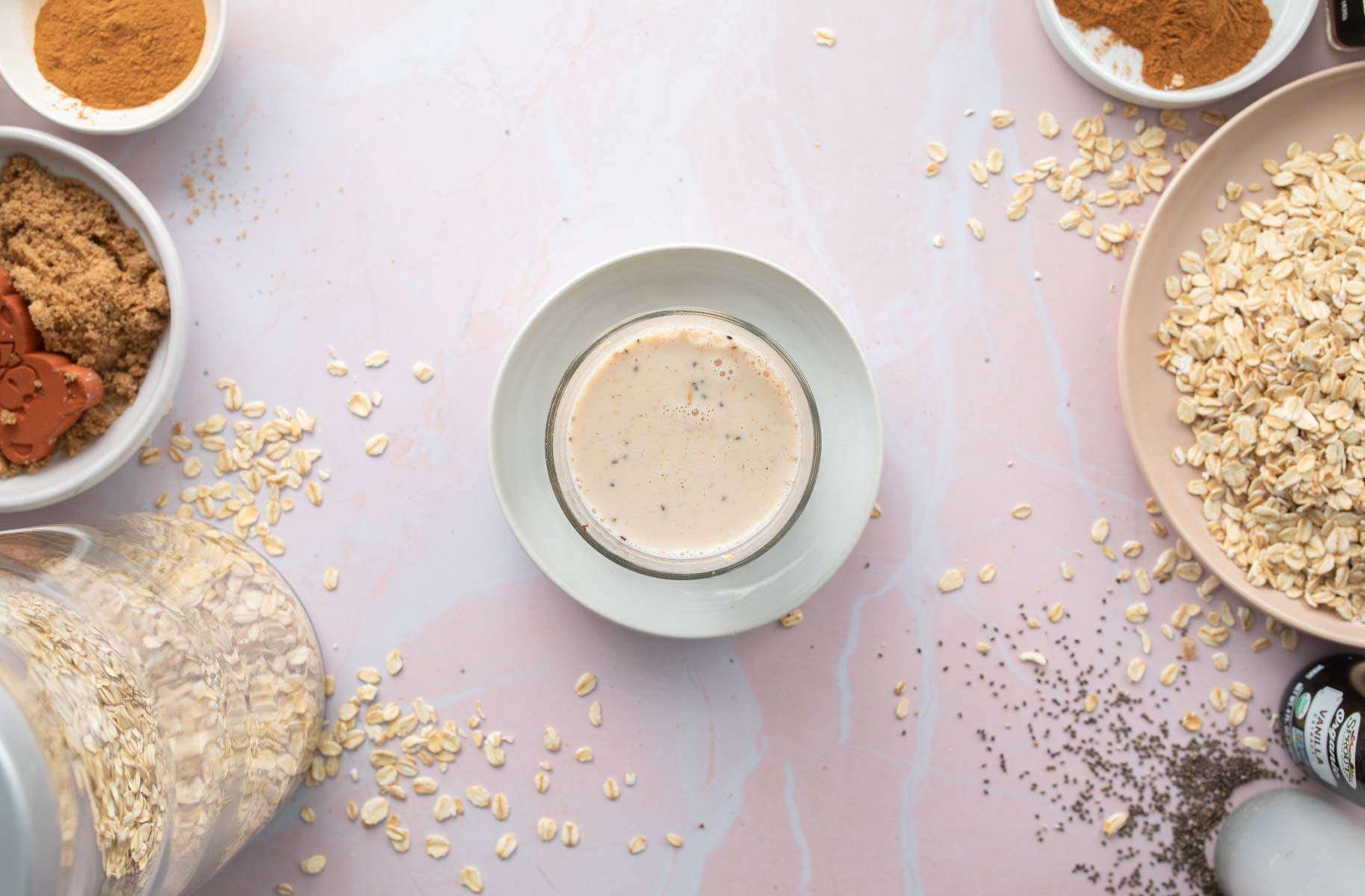 milk covering oats in a glass