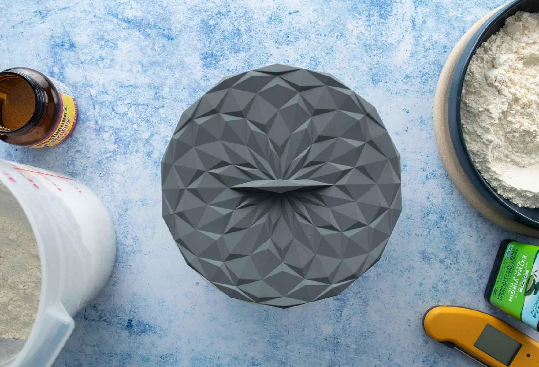 round grey silicone lid on table