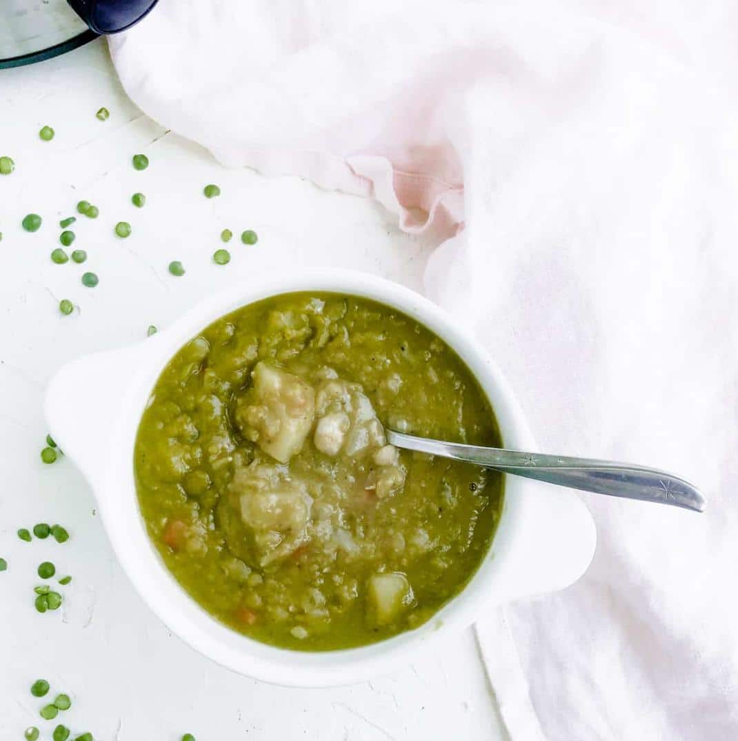 split pea soup in bowl with spoon