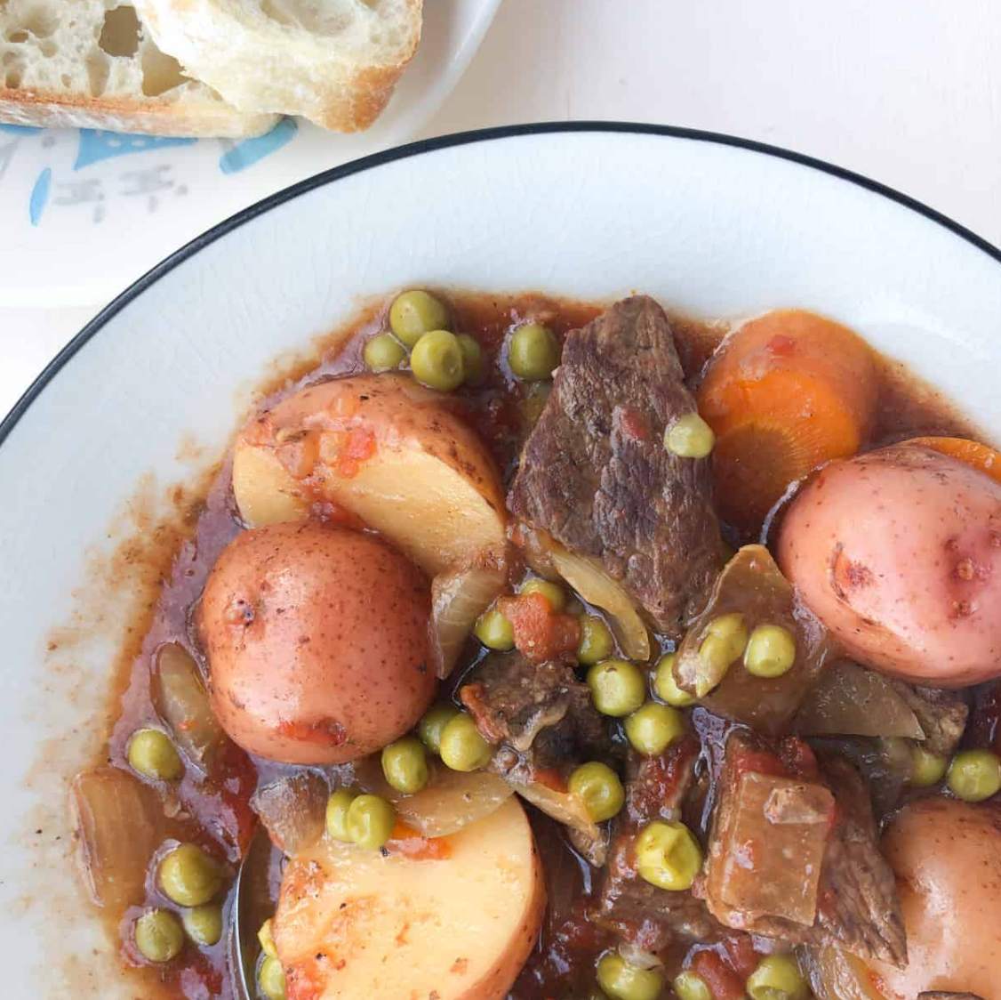 close up of beef stew in white bowl