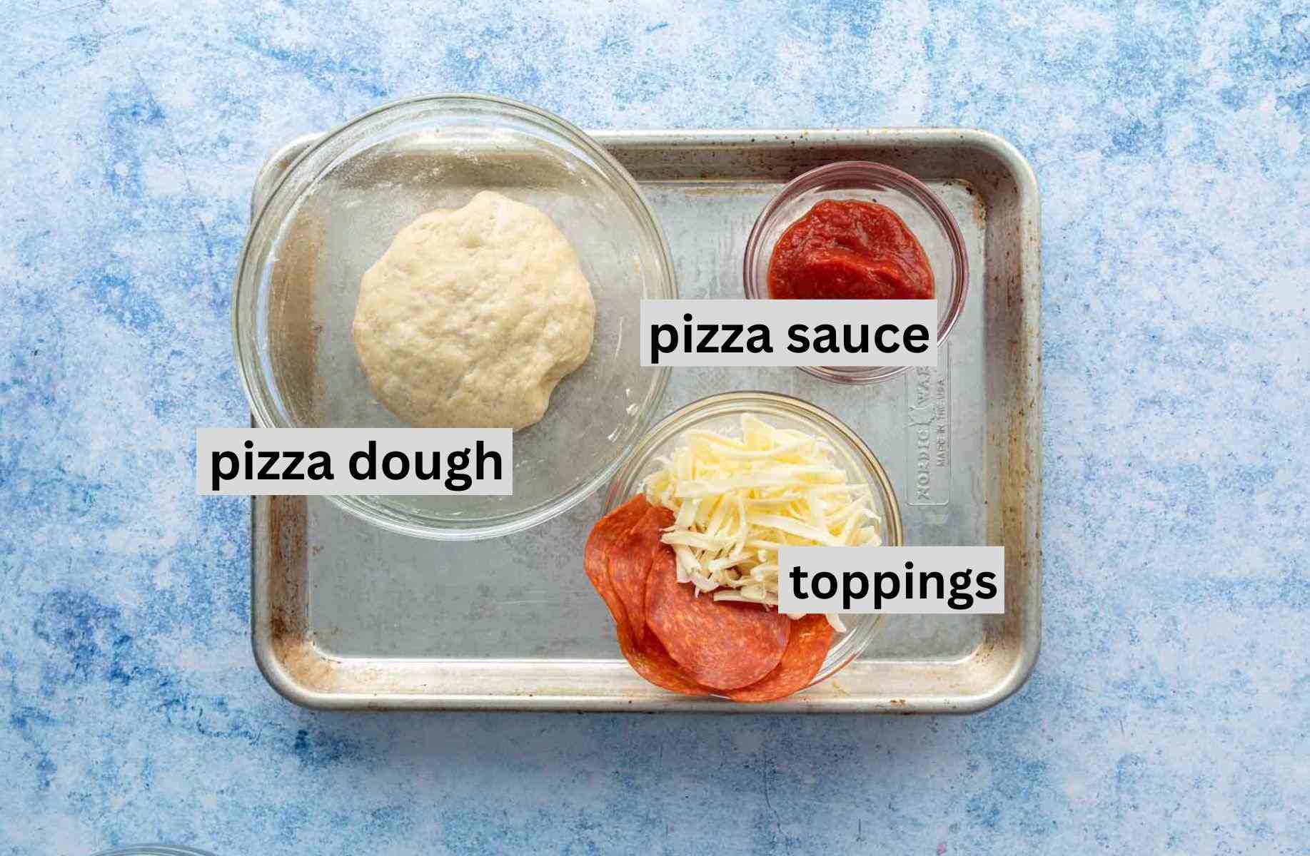 pizza ingredients on pan