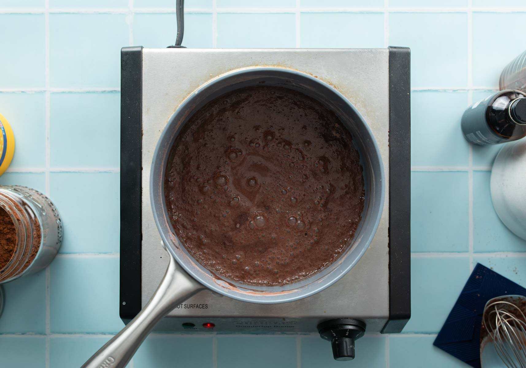 simmering chocolate pudding in saucepan